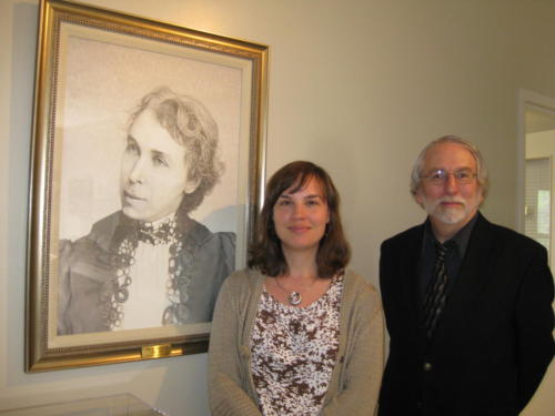 Susan McAdam and Dr. David Frank with Ella Hatheway's portrait. (Janet Riddell photo)