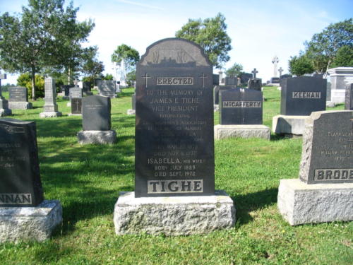 This Headstone of James E. Tighe was erected in St. Joseph’s Cemetery in 1938 by Local 273 of the International Longshoremen’s Association. James Tighe was a pioneer in provincial labour history and rose to the rank of first vice-president of the International Longshoremen’s Association. He came to an untimely death in 1937 as a result of a car accident. Note the image of a modern cargo ship at the top of the headstone.
