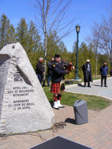 Joe Vautour concluded the moment of silence by playing the bagpipes. 